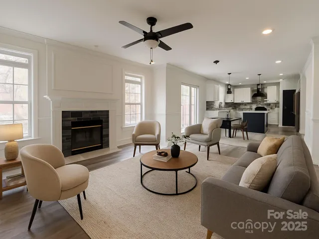a living room with furniture and a fireplace