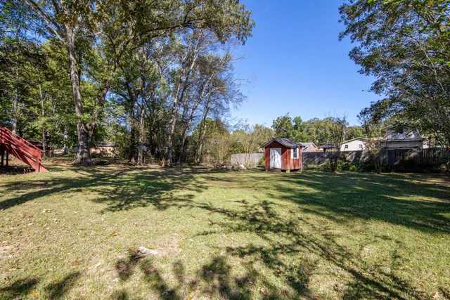 a view of a yard with a tree