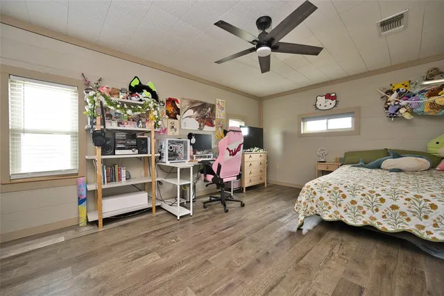 a bedroom with bed and a window