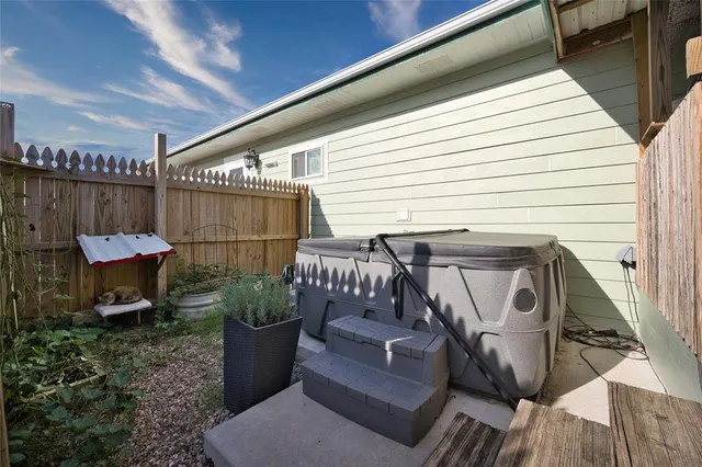 a view of a chairs and table in the balcony