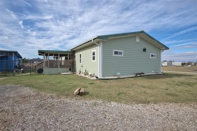 a house view with a backyard space