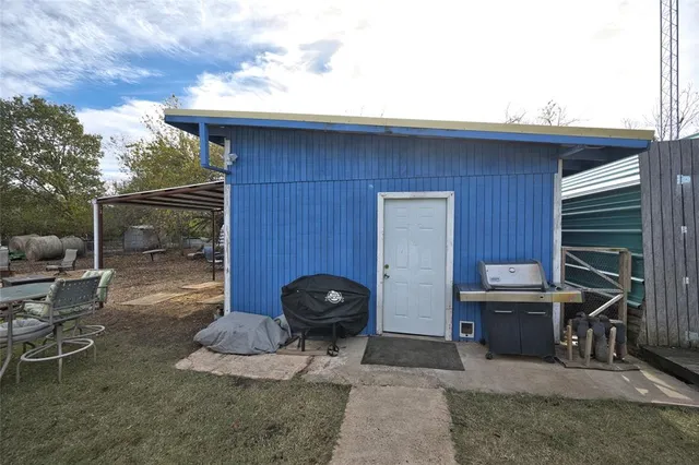 a view of a chairs and table in a patio