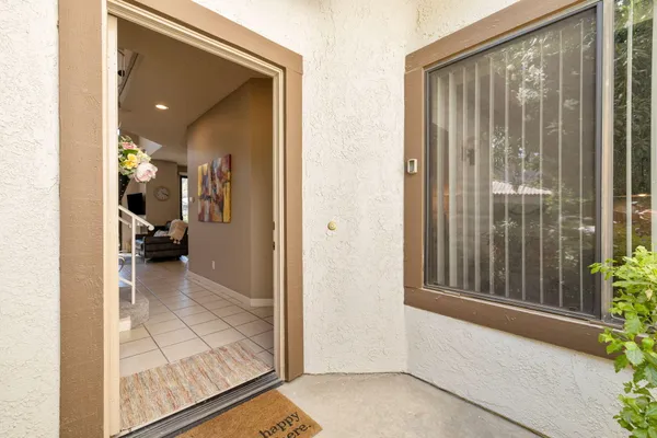 a front view of a house with garden