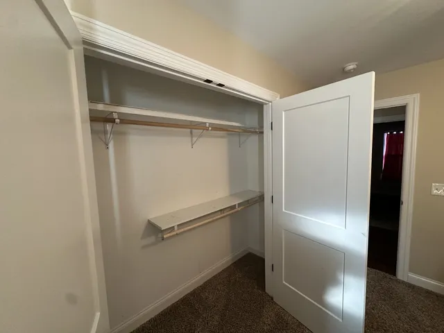 a balcony with wooden floor and outdoor space