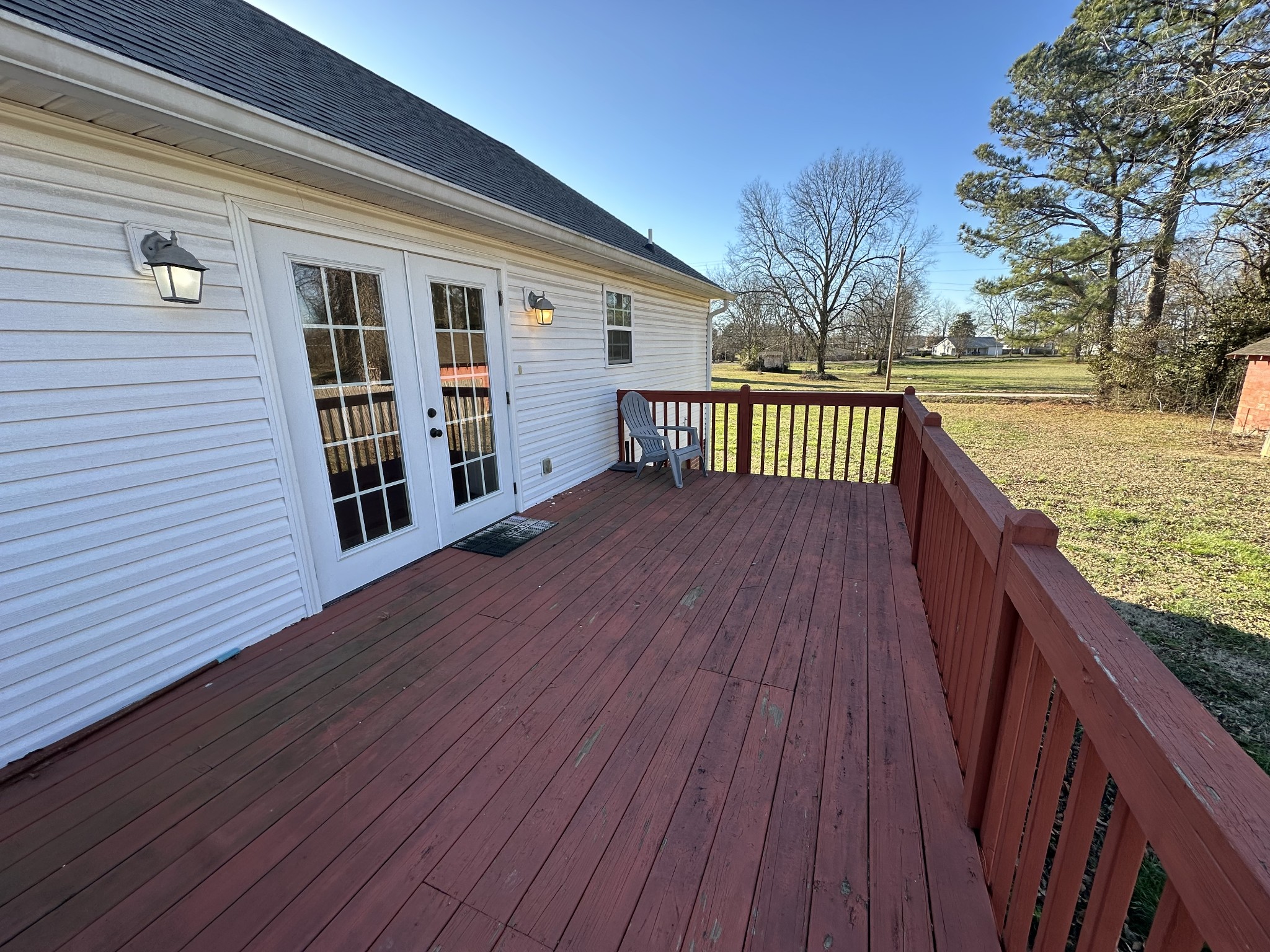 104 Lincoln Street Ethridge, TN 38456 - Photo 20 of 23 a balcony with wooden floor and outdoor space