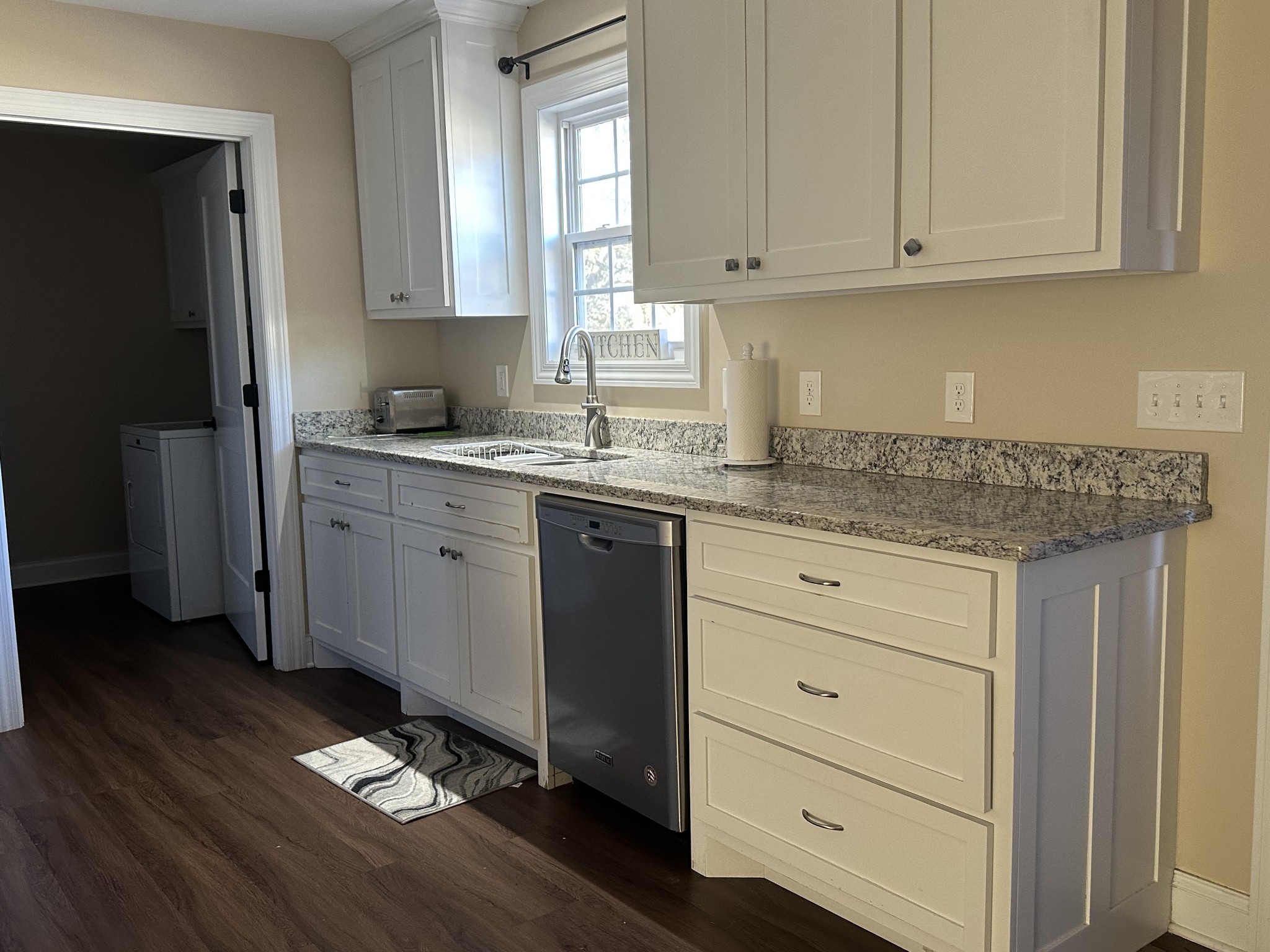 104 Lincoln Street Ethridge, TN 38456 - Photo 4 of 23 a kitchen with granite countertop cabinets stainless steel appliances a sink and dishwasher
