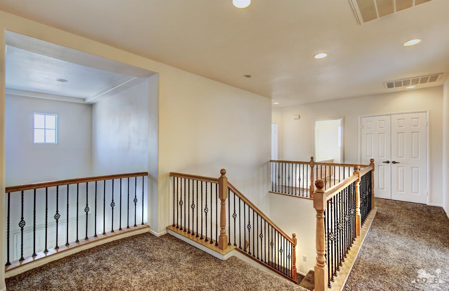 83275 Lightning Road Indio, CA 92203 - Photo 14 of 28 a view of hallway with stairs