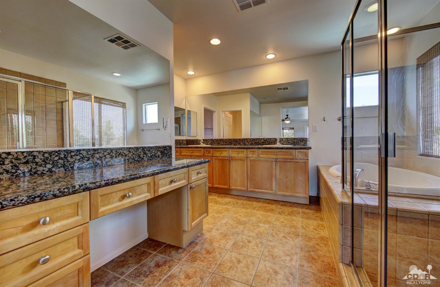83275 Lightning Road Indio, CA 92203 - Photo 15 of 28 a large kitchen with stainless steel appliances and a counter space