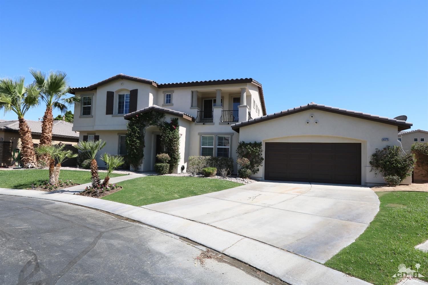 83275 Lightning Road Indio, CA 92203 - Photo 27 of 28 a front view of a house with a yard and garage