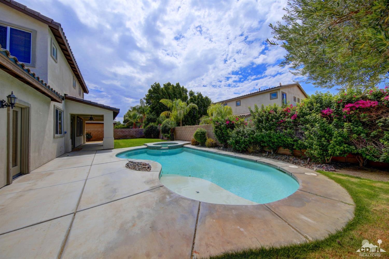 83275 Lightning Road Indio, CA 92203 - Photo 8 of 28 a view of a house with backyard and garden