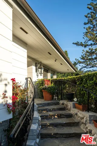 a outdoor space with lots of potted plants