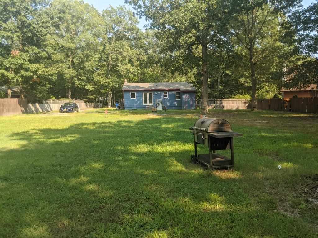 380 Perry Road Woodbine, NJ 08270 - Photo 14 of 19 a view of a house with a yard and sitting area