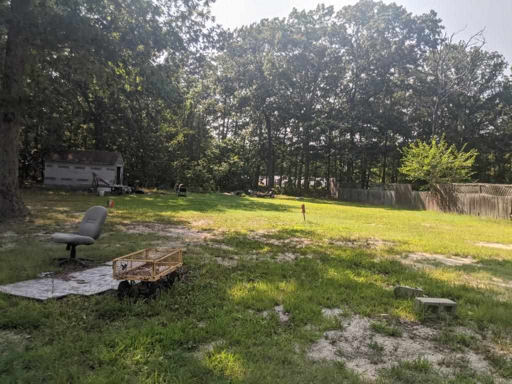 380 Perry Road Woodbine, NJ 08270 - Photo 19 of 19 a view of a swimming pool and lounge chairs in back yard of the house