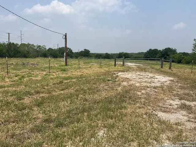 a view of a lake with houses in the back