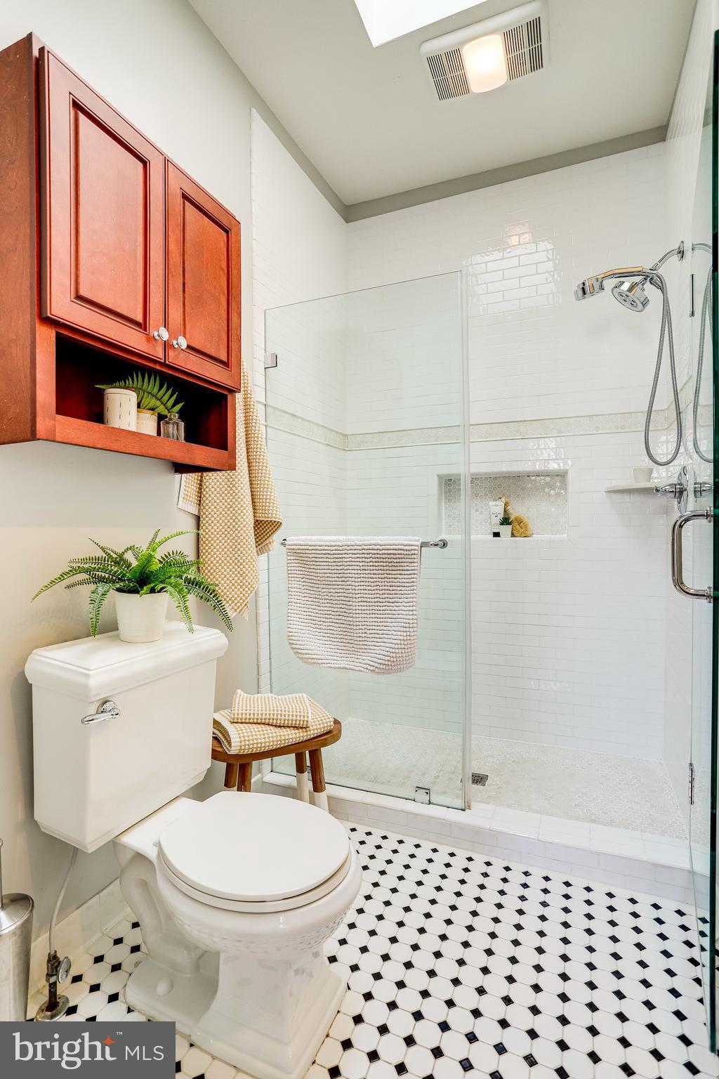 143 E Street Southeast Washington, DC 20003 - Photo 27 of 59 Subway tile in glass stall shower of ensuite bath