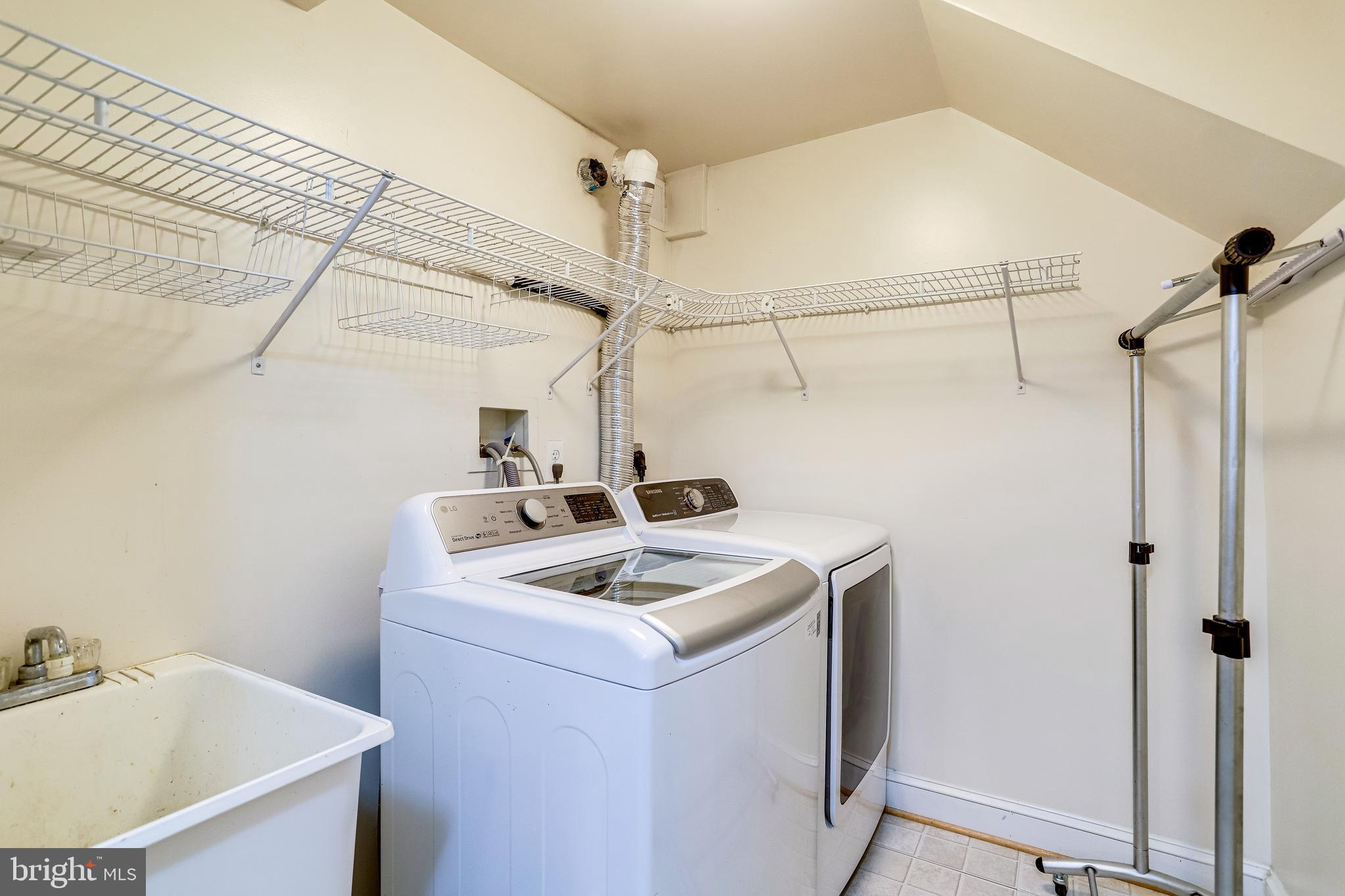 143 E Street Southeast Washington, DC 20003 - Photo 43 of 59 Large laundry room w/sink + storage shelves