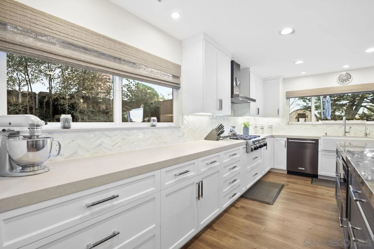1353 Eastside Road El Cajon, CA 92020 - Photo 13 of 43 a large white kitchen with a large window