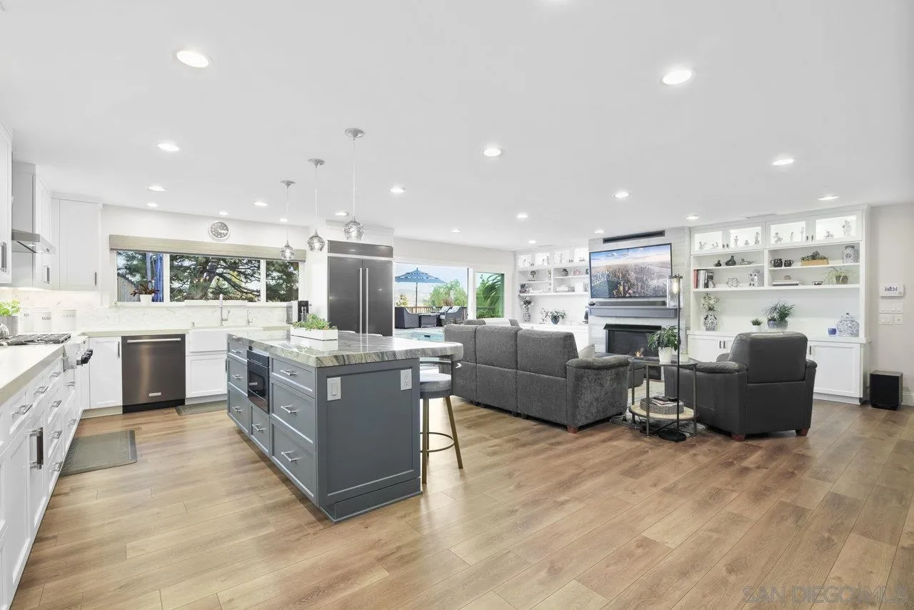 1353 Eastside Road El Cajon, CA 92020 - Photo 14 of 43 a large open kitchen with stainless steel appliances kitchen island granite countertop a large counter top and stainless steel appliances