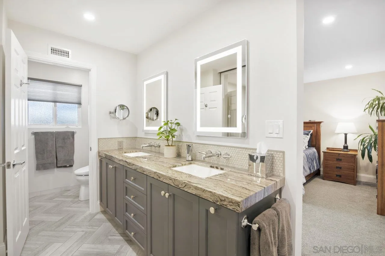 1353 Eastside Road El Cajon, CA 92020 - Photo 21 of 43 a bathroom with a granite countertop sink and a mirror