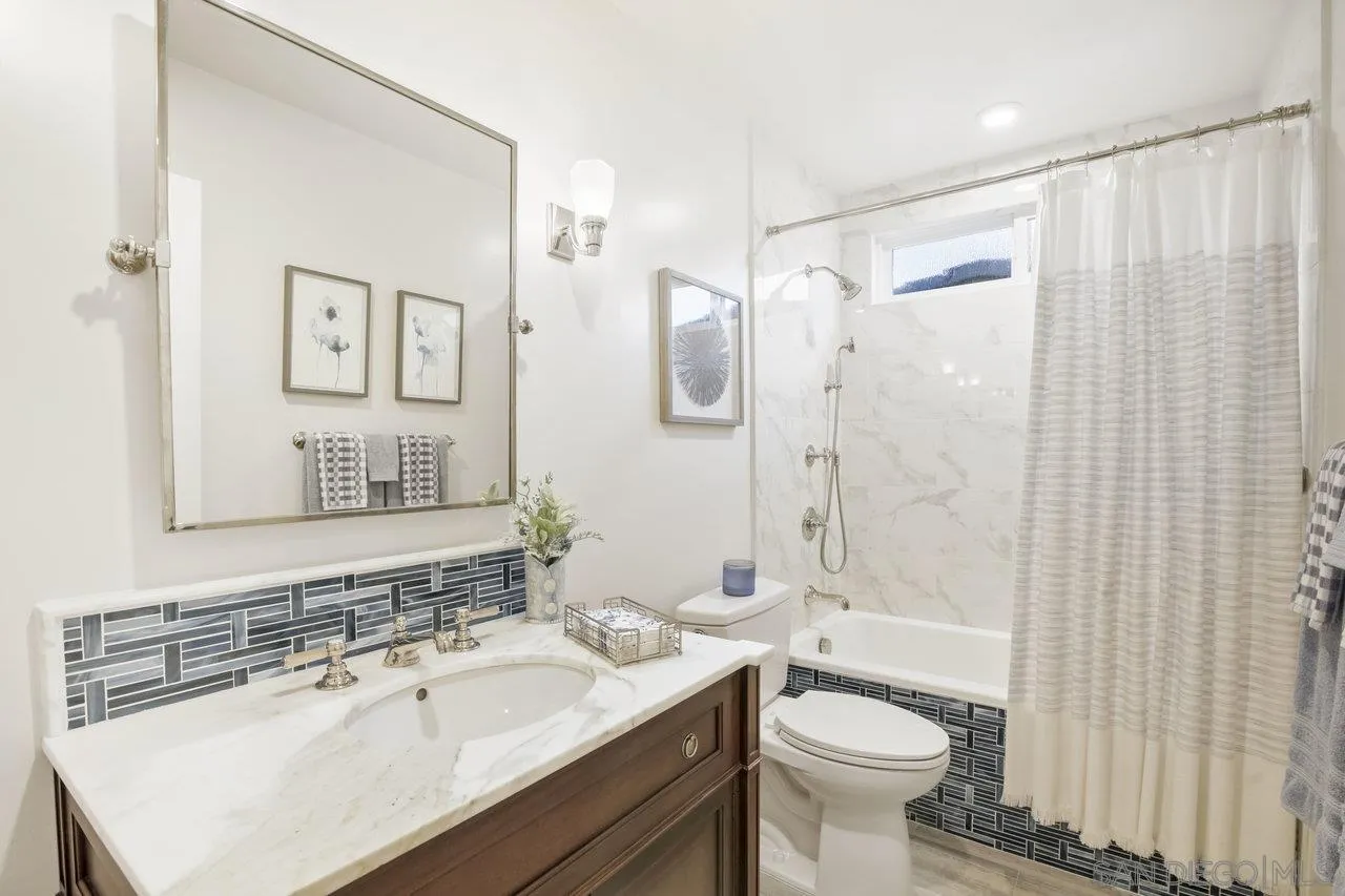 1353 Eastside Road El Cajon, CA 92020 - Photo 23 of 43 a bathroom with a sink toilet and shower