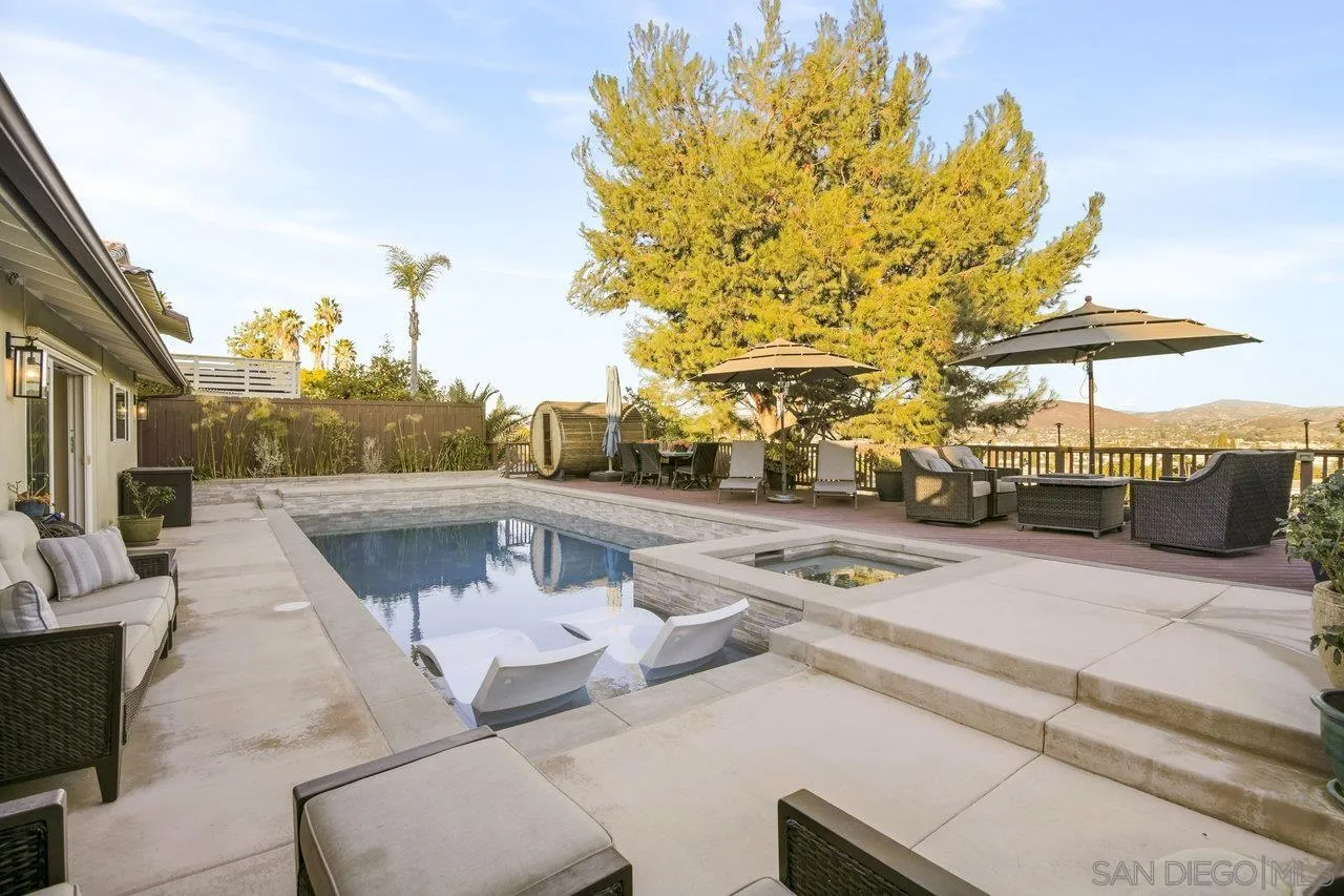 1353 Eastside Road El Cajon, CA 92020 - Photo 38 of 43 a terrace of a building with barbeque oven table and chairs