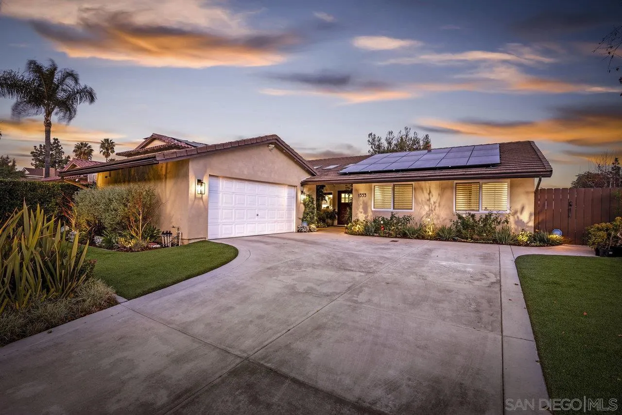 1353 Eastside Road El Cajon, CA 92020 - Photo 40 of 43 a view of a house with a yard and table and chairs under an umbrella