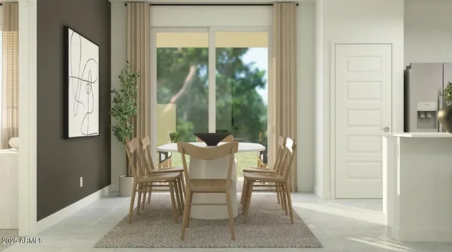 a view of a dining room with furniture and a window