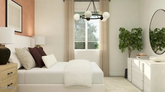 a bedroom with a large bed and a window