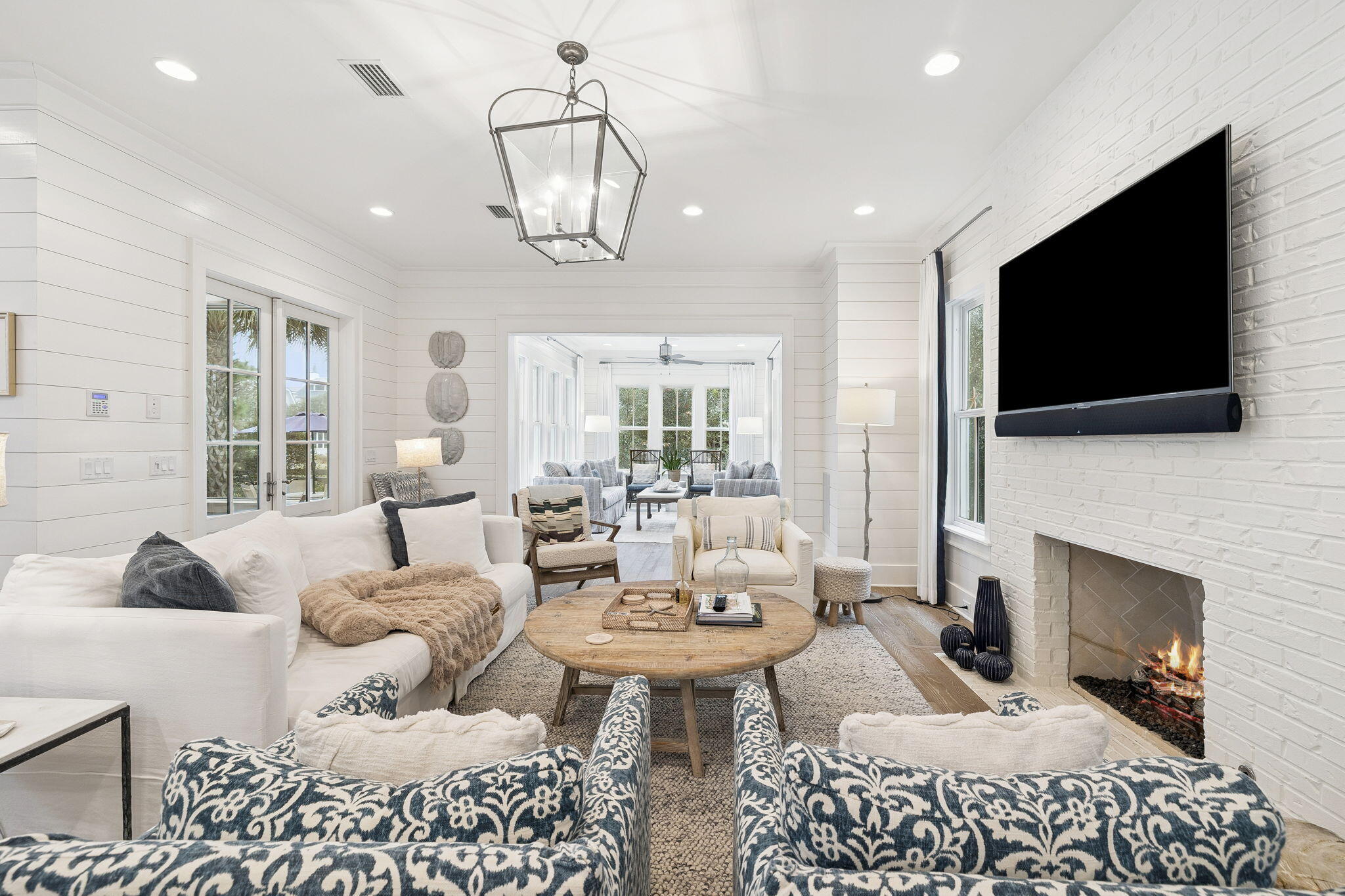 17 Compass Point Way Watersound, FL 32461 - Photo 25 of 73 a living room with furniture a flat screen tv and a fireplace