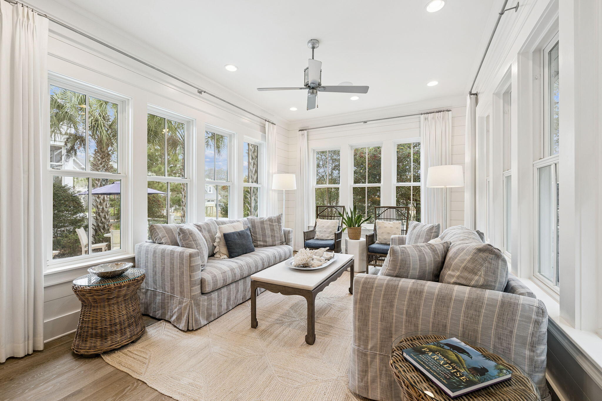 17 Compass Point Way Watersound, FL 32461 - Photo 29 of 73 a living room with furniture and floor to ceiling windows
