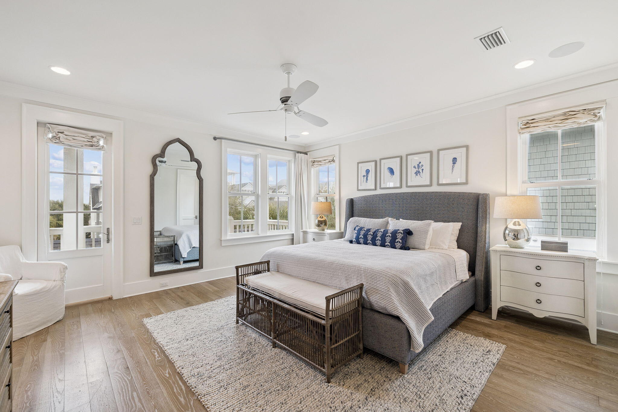 17 Compass Point Way Watersound, FL 32461 - Photo 45 of 73 a spacious bedroom with a large bed and a wooden floor