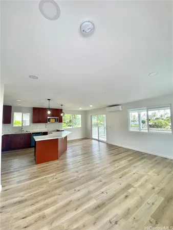 a view of kitchen and dining room with wooden floor