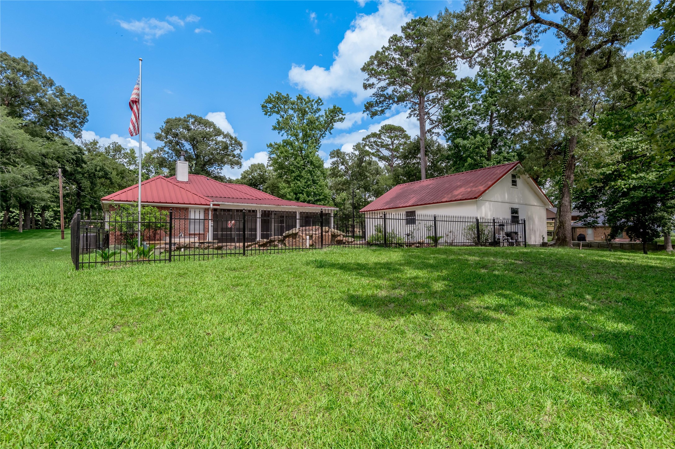 324 Red Oak Lane Trinity, TX 75862 - Photo 42 of 49 a front view of a house with yard and green space