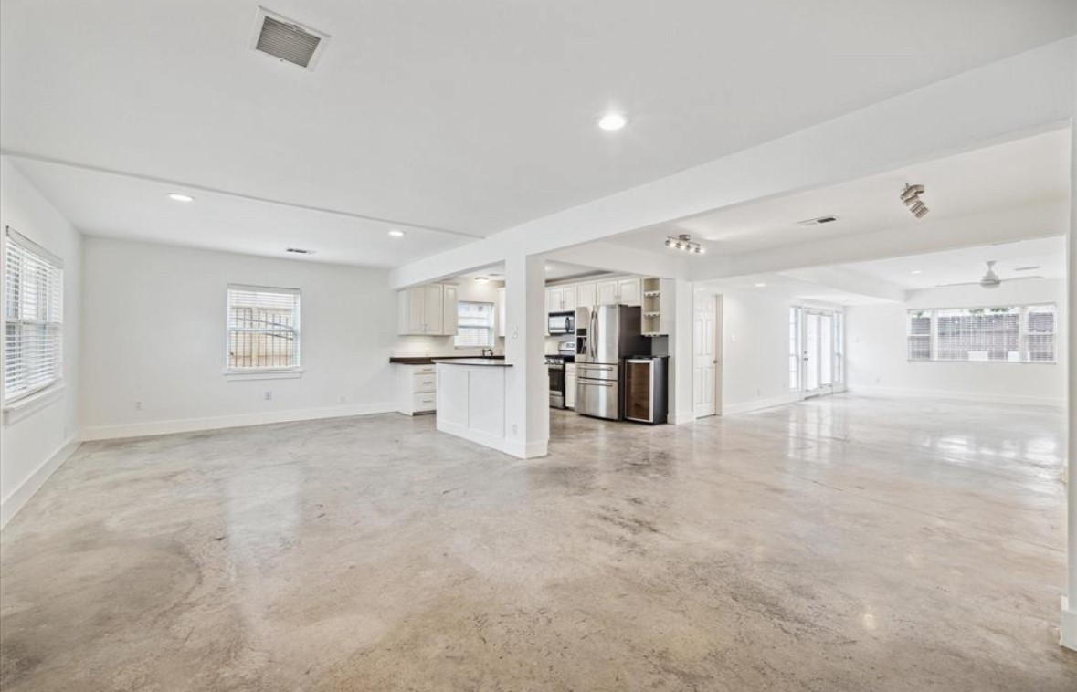 3818 Childress Street Houston, TX 77005 - Photo 3 of 10 a view of an empty room with a kitchen