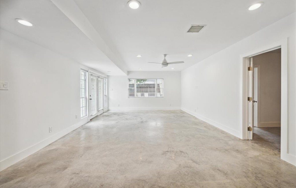 3818 Childress Street Houston, TX 77005 - Photo 4 of 10 an empty room with a empty space and windows