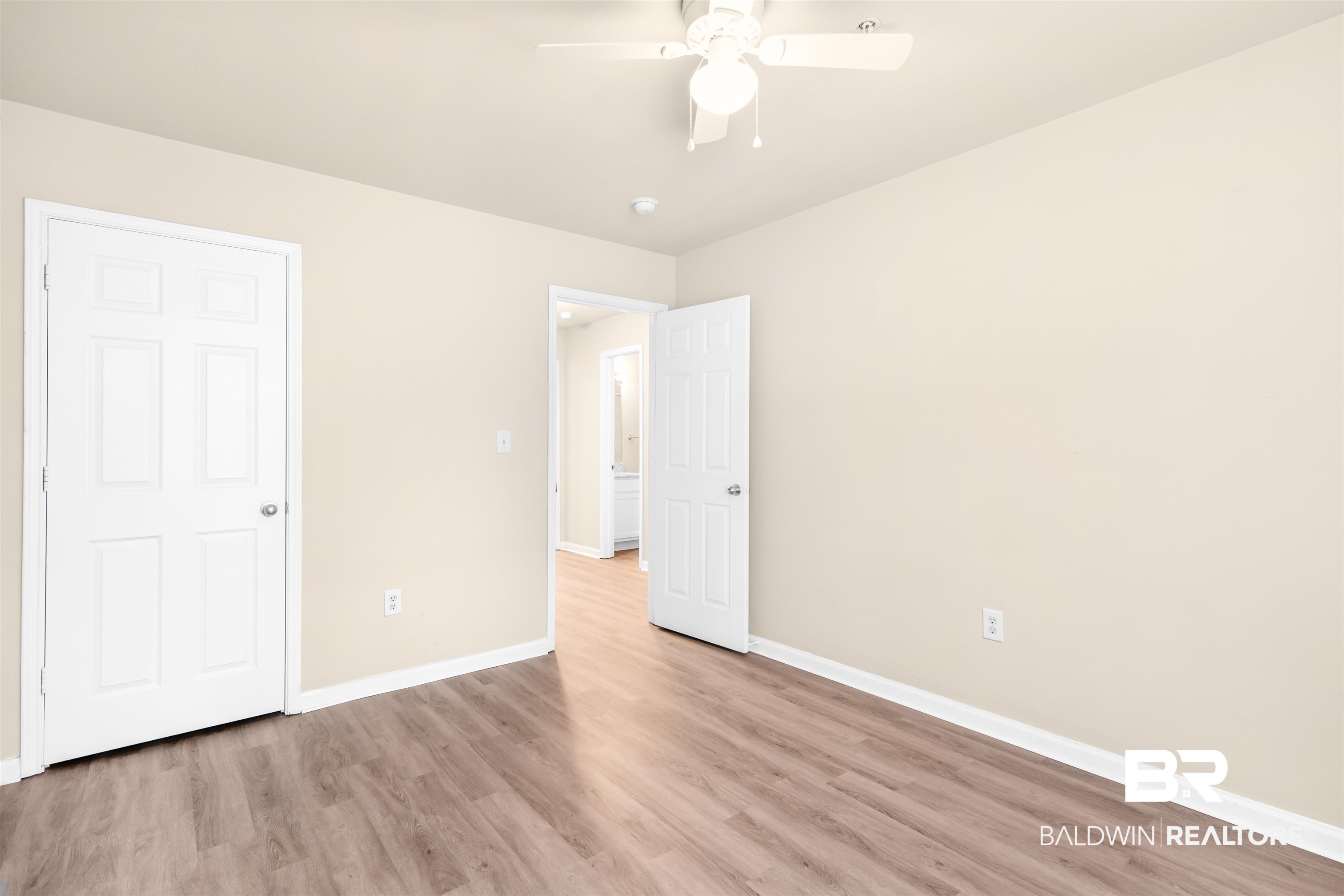 1517 Regency Road, Unit 85 Gulf Shores, AL 36542 - Photo 14 of 32 Unfurnished bedroom with ceiling fan and light wood-type flooring
