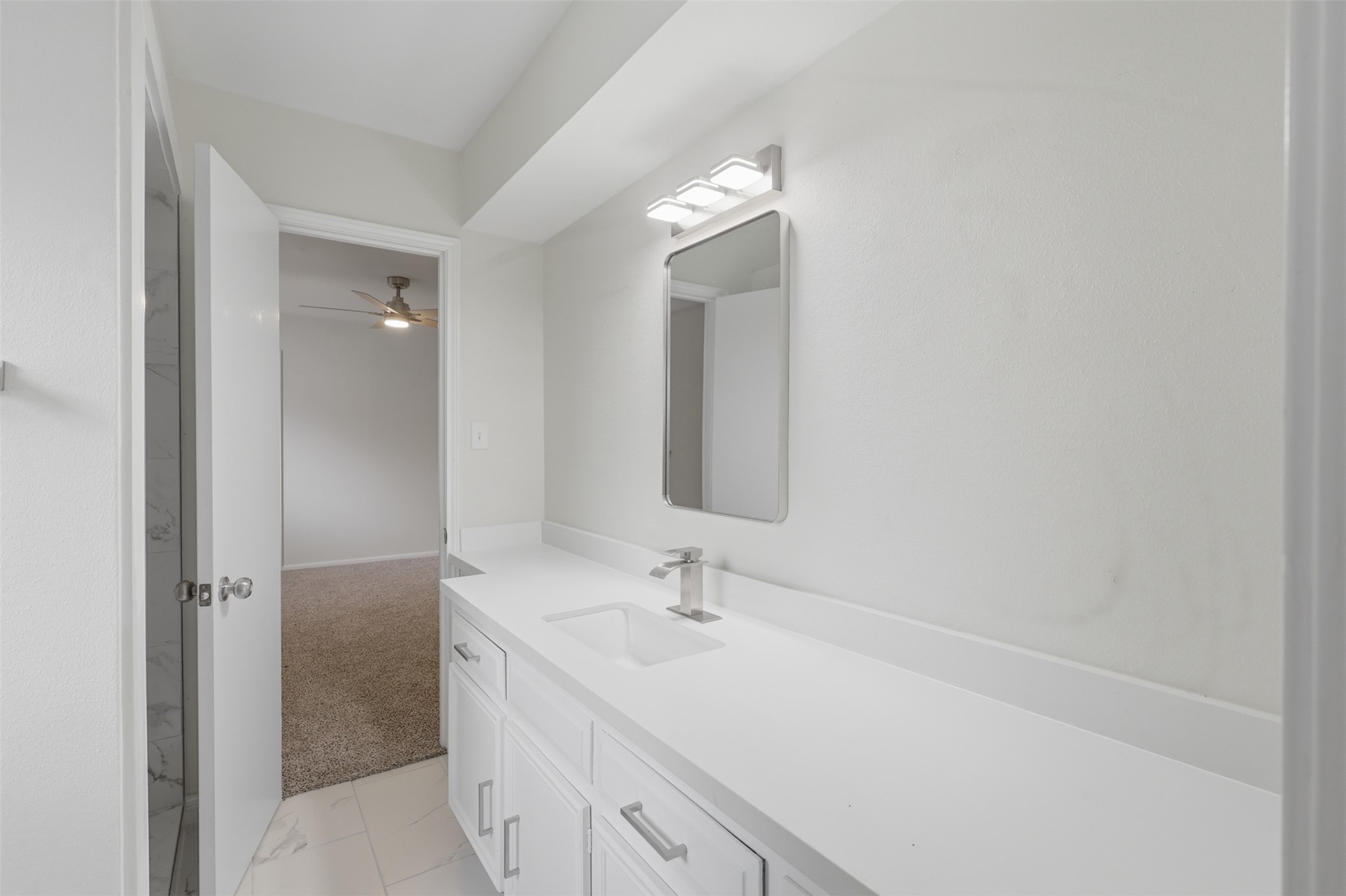 17519 Butte Creek Road Houston, TX 77090 - Photo 29 of 37 Secondary Bathroom with NEW lighting, mirror, and vanity!