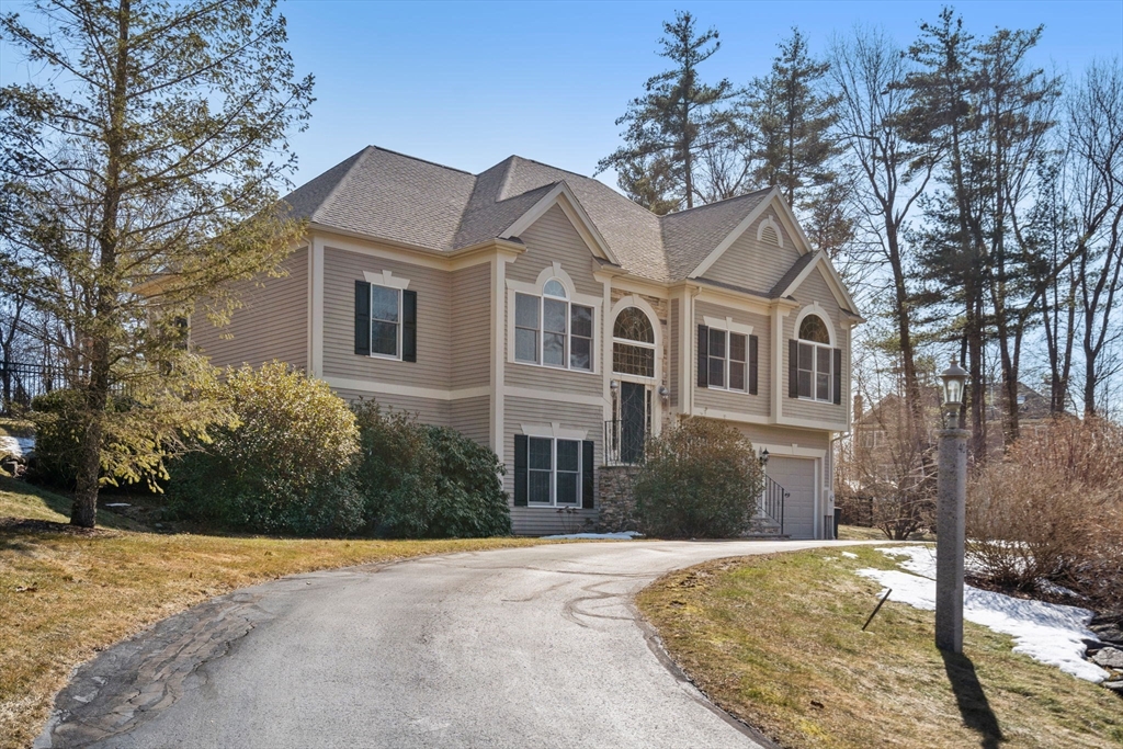 40 Sandy Ridge Road Sterling, MA 01564 - Photo 26 of 33 a front view of a house with a yard and trees