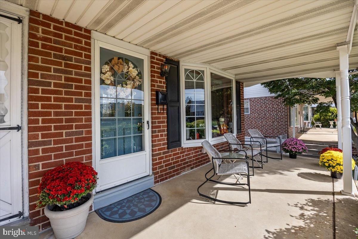 3415 Holyoke Road Philadelphia, PA 19114 - Photo 2 of 37 Charming entryway with vibrant blooms.