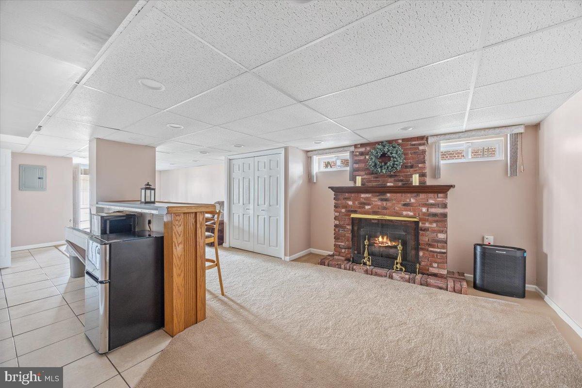 3415 Holyoke Road Philadelphia, PA 19114 - Photo 26 of 37 Cozy basement retreat with a gas fireplace.