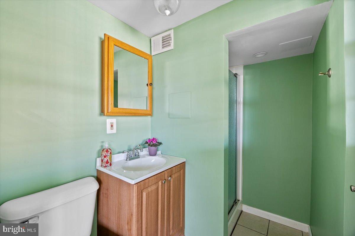 3415 Holyoke Road Philadelphia, PA 19114 - Photo 30 of 37 Charming green bathroom with modern touches.