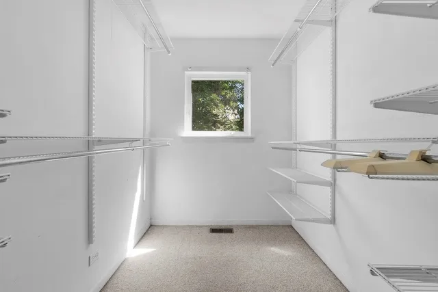 a view of a room that has a window in it