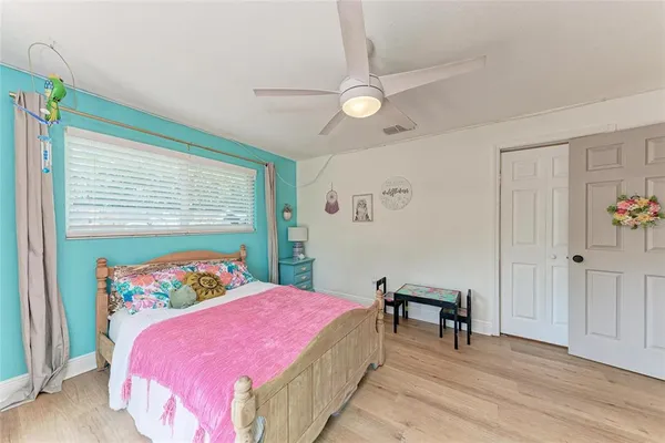 a bedroom with a bed and a table