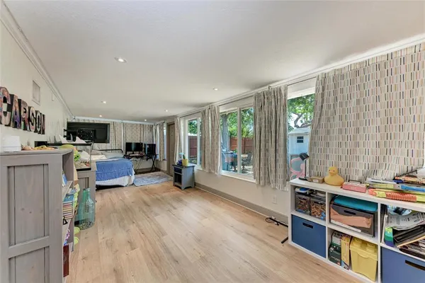 a room with furniture a rug and a window