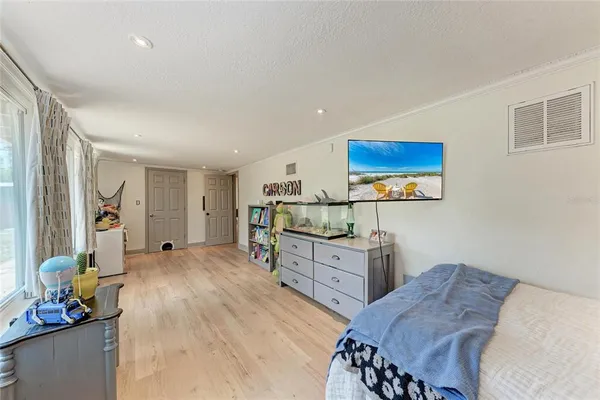 a bedroom with a bed and furniture