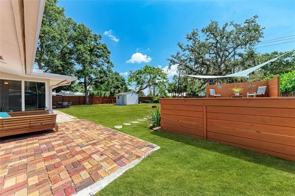 a view of a back yard of the house