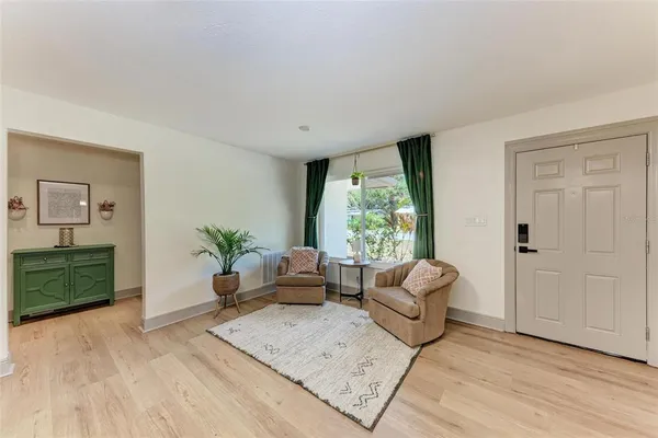 a living room with furniture and a large window