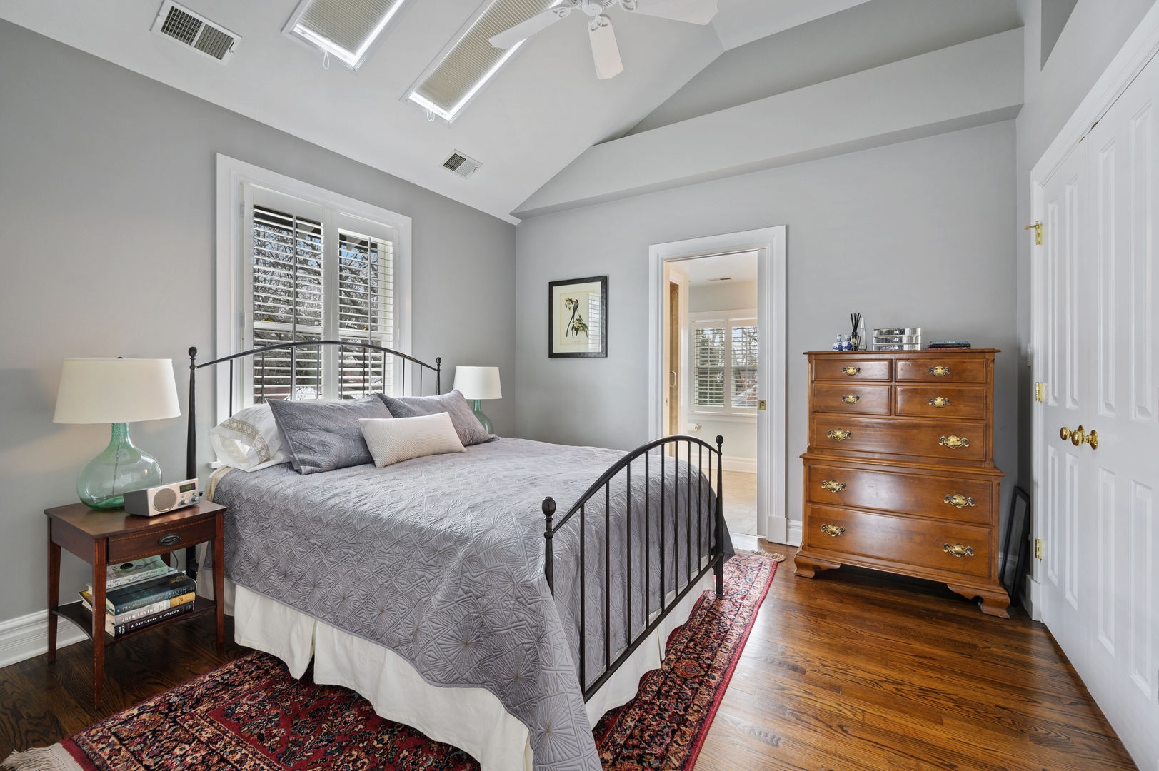 1054 Tower Road Winnetka, IL 60093 - Photo 18 of 32 a bedroom with a bed and wooden floor