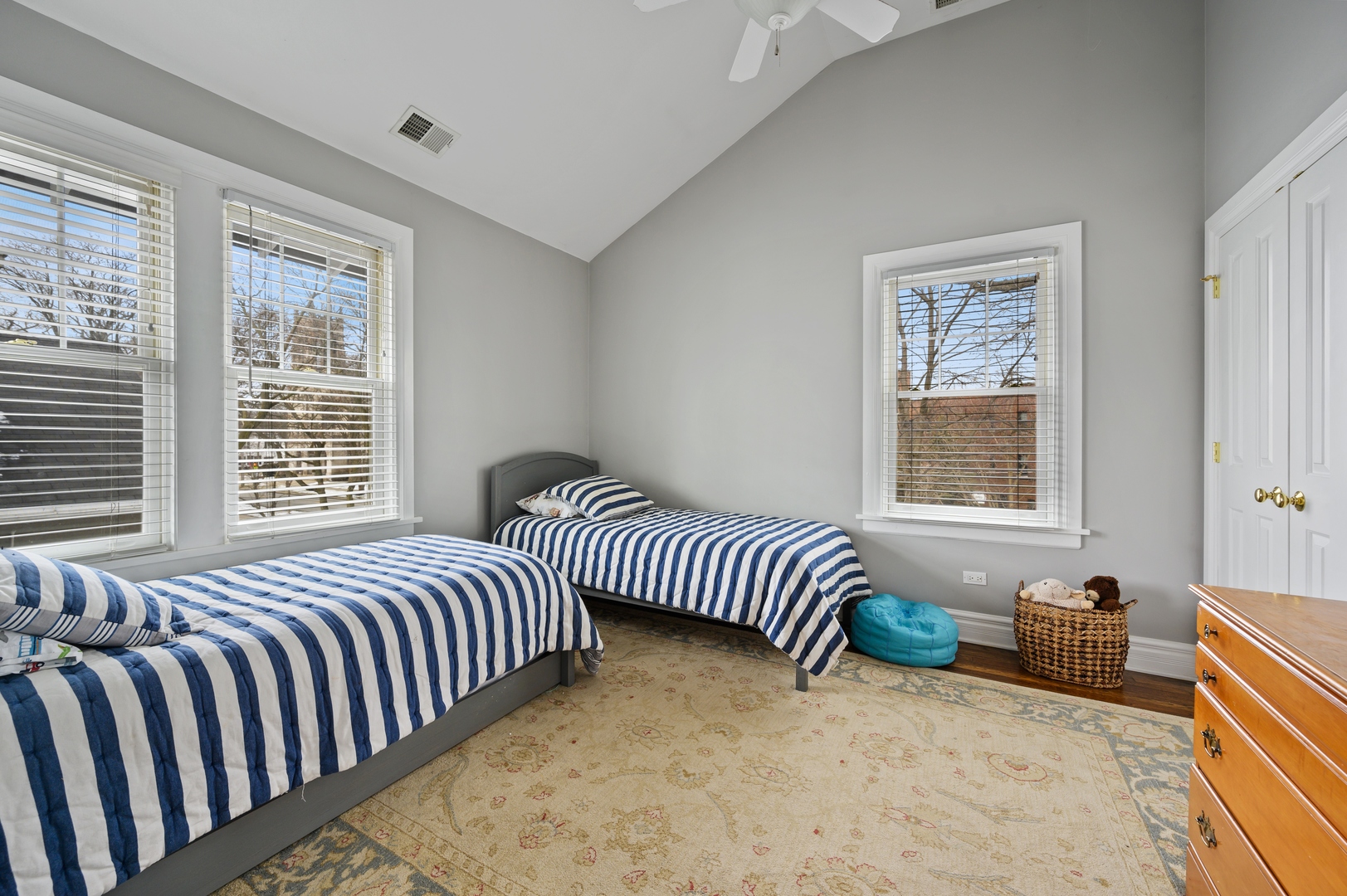 1054 Tower Road Winnetka, IL 60093 - Photo 20 of 32 a bedroom with a bed and a window