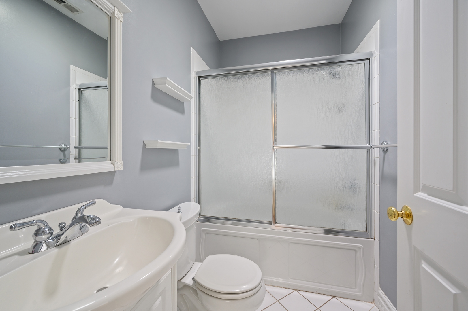 1054 Tower Road Winnetka, IL 60093 - Photo 21 of 32 a bathroom with a sink toilet and shower